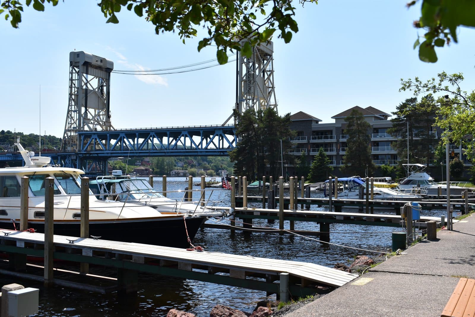 Marina and lift bridge, Hancock MI | State Wide Real Estate of Houghton Boats docked at Houghton County Marina in Hancock with the Portage Lake Lift Bridge behind