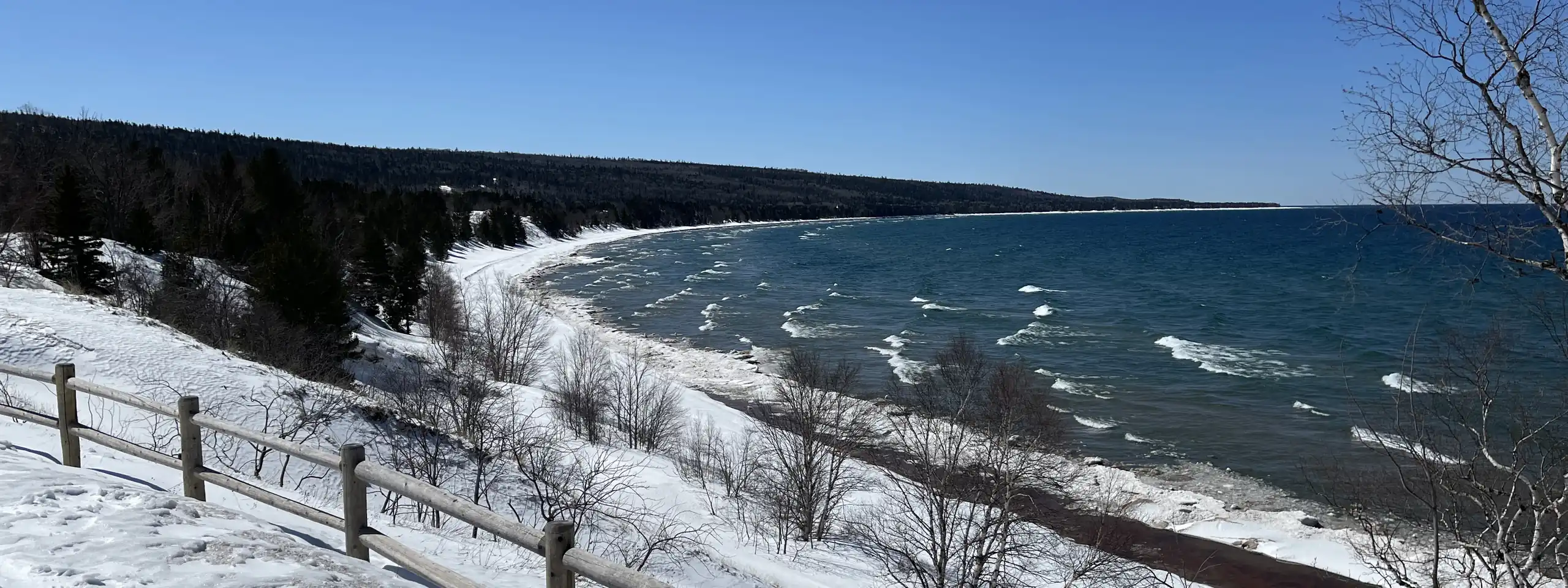 A curving Lake Superior bay seen from an overlook in early spring.